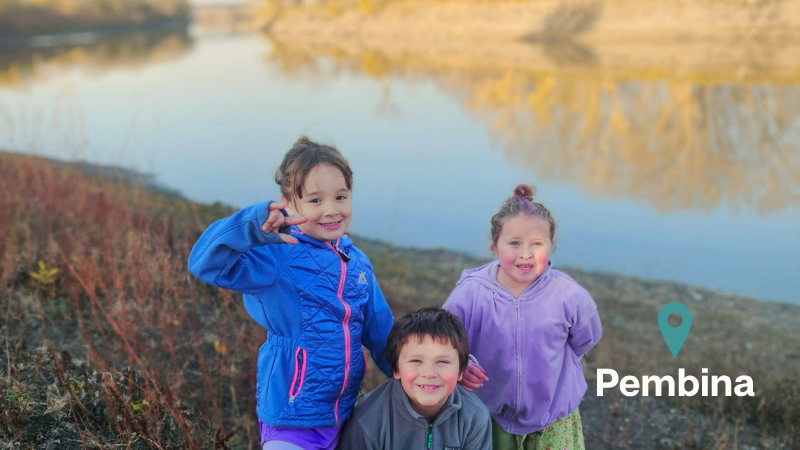 children on the banks of the Red River in Pembina